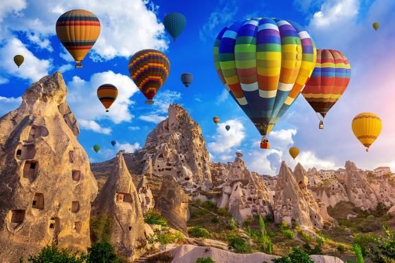 Colourful hot air balloons flying over Cappadocia, Turkey.