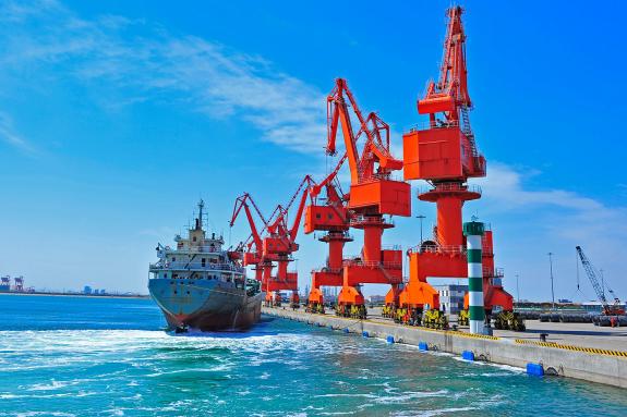 Port crane bridge and bulk carrier, China.